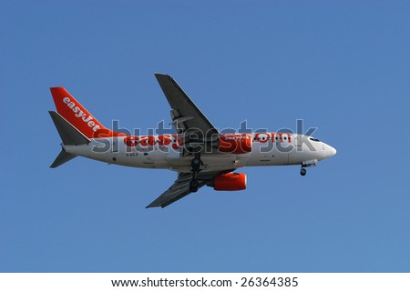 FARO, PORTUGAL - JUNE 27 : AnEasyjet aeroplane lands at Faro International Airport , on June 27, 2008 in Faro, Portugal.
