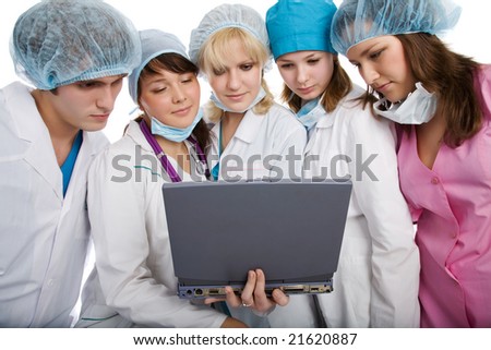 Group of young doctors with laptop