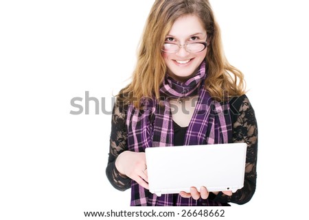 Cute young woman thinking while at computer