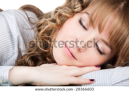 Photo of young pretty girl having a nap, isolated