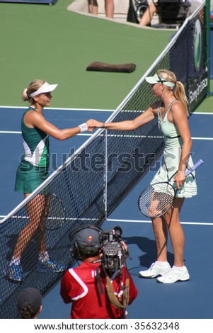 TORONTO - AUGUST 19: Maria Sharapova (R) of Russia shakes hand with Sybille Bammer of Austria after a match at the Rogers Cup on August 19, 2009 in Toronto, Canada. Sharapova defeated Bammer in this match.