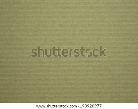 brown corrugated paper background seeing a detail and color and line on the paper