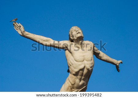 Icarus statue trying to fly to the sun