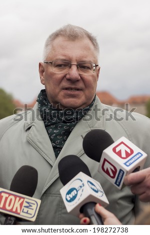SZCZECIN, POLAND - MAY 29, 2014: Veterans Day in Poland. Maciej Jankowski answer the questions during the press conference. Jankowski is a Polish Under Secretary of State for Ministry of Defence.