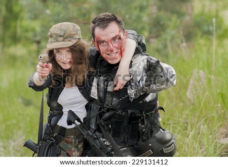 SZCZECIN, POLAND - MAY 31, 2014: Wounded Woman and Soldier in Polish Army Uniform during  Historical reenactment