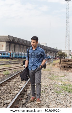Asia young Man standing alone outdoor