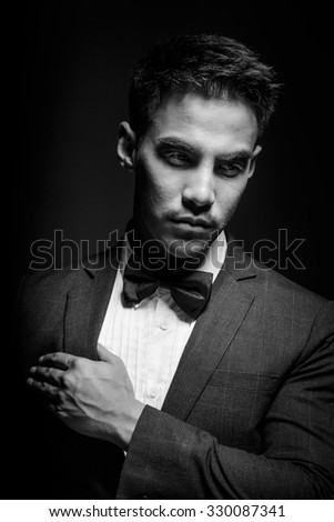Asia men fashion suits low key lighting - filter Black and White