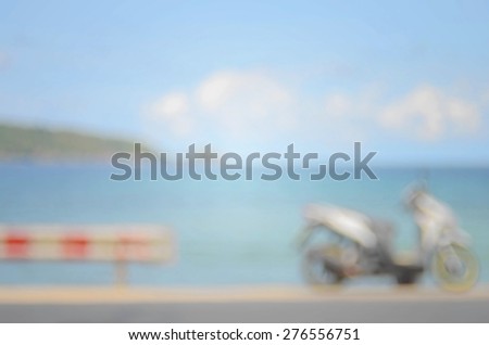Blurred motorbike on beach abstract background.Travel concept.