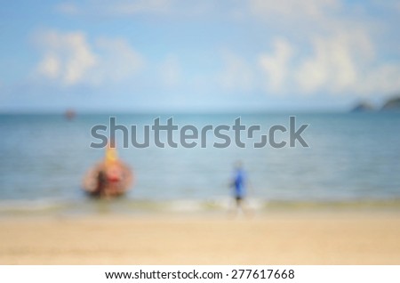 Beach background.Blurred boat on beach and man walking abstract background.