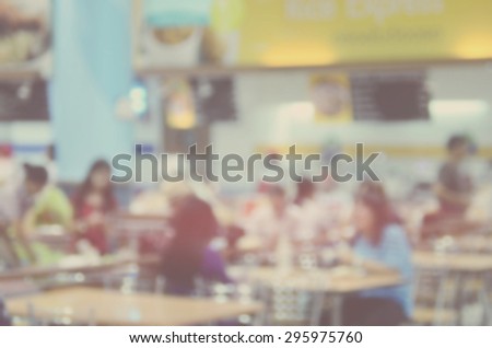 Blurred food court in shopping center mall abstract background.Retro color style.