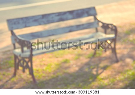 Blur outdoor chair in nature park abstract background.Retro color style.