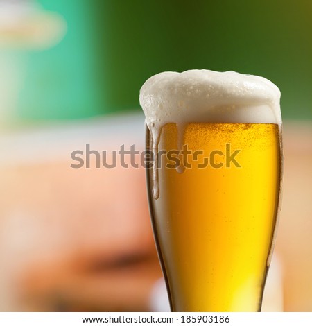 Glass of light beer in pub