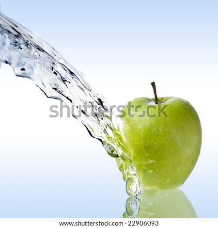 fresh water splash on green apple