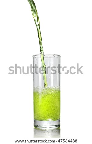 green juice pouring into glass isolated on white