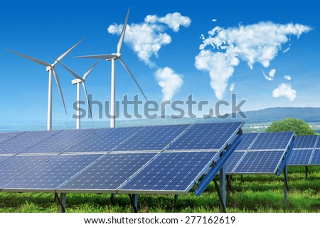 solar panels and wind turbines under blue sky with world map made of clouds