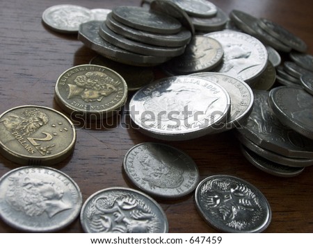 Australian coins on wooden table.