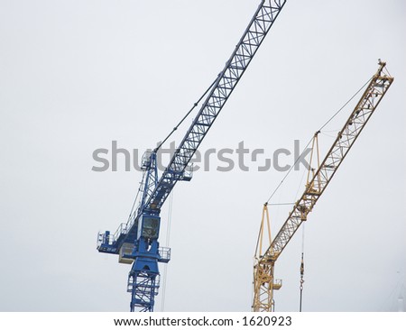 Two construction cranes.