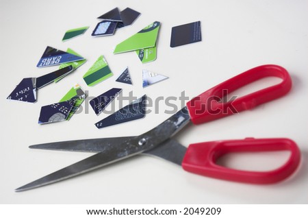 Bank cards cut up with scissors. Illustrates financial issues such as credit problems, bankcruptcy, budgeting and personal financial management.
