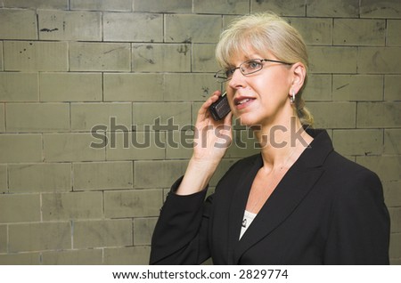 Mature business woman in train station.