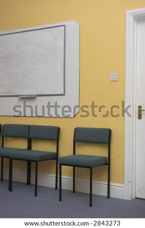 Empty classroom or meeting room / venue with blank whiteboard.