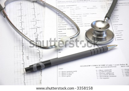 Medical still life with Hospital admission paperwork and a Doctor's stethoscope.