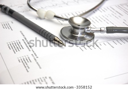 Medical still life with Hospital admission paperwork and a Doctor\'s stethoscope.