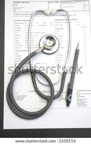 Medical still life with Hospital admission paperwork and a Doctor\'s stethoscope.