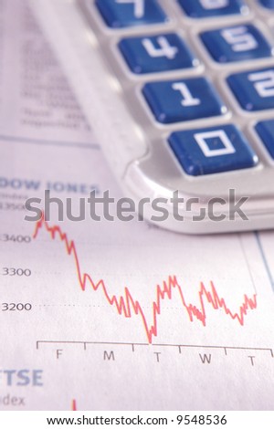 Analysing stock performance chart. Very shallow depth of field.