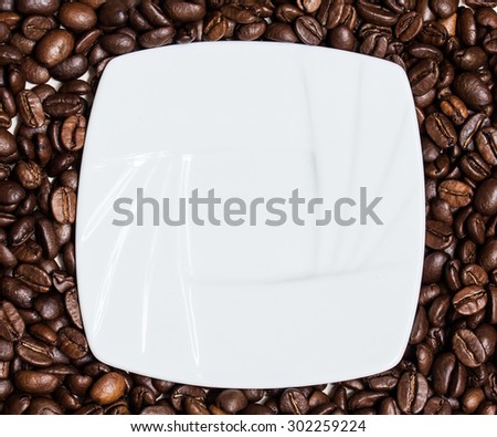 Coffee  background, grains of coffee plant and white saucer. Coffee  time.