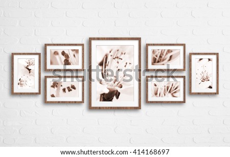 Frames collage with floral posters,spring blossom  on bricks textured wall