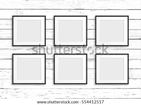 Group of black frames on old white painted wooden panels wall, Gallery style design mock up