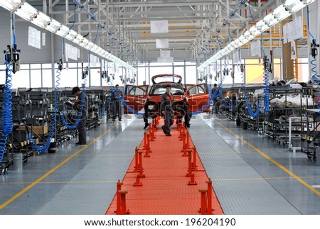 People work in the car factory in Lovech, Bulgaria, February 21, 2012