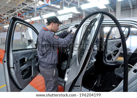 People work in the car factory in Lovech, Bulgaria, February 21, 2012