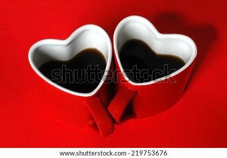 Red heart cup of coffe on the table