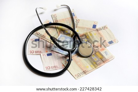 stethoscope on money euro paper banknotes isolated