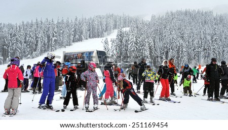Tourists skiing Ski resort Bansko, Bulgaria Feb 25, 2011. Panorama of winter mountains.