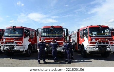 Sofia, Bulgaria - June 9, 2015: New fire trucks are presented to their firefighters in a field next to the main Fire department administrative building in Sofia.