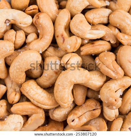 Salted roasted peanuts texture background.