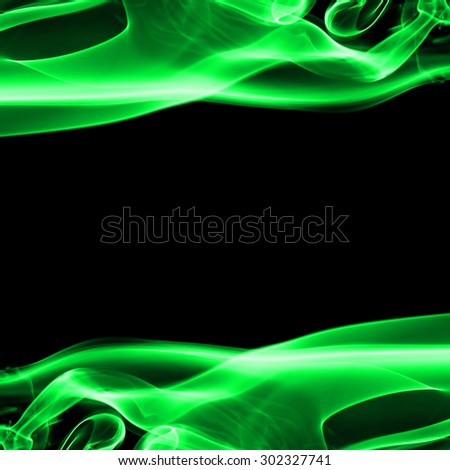 Abstract green smoke on black background with space.