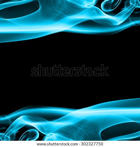 Abstract blue smoke on black background with space.