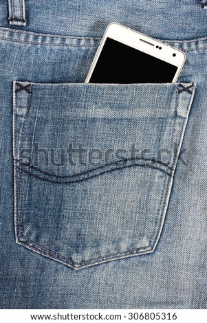 white mobile phone in pocket jean with black screen.