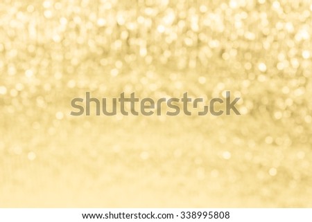 Gold festive glitter background with defocused lights ,chtistmas background.
