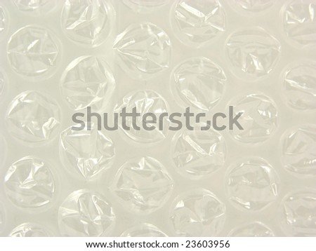 Background with bursted bubbles of a plastic package foil