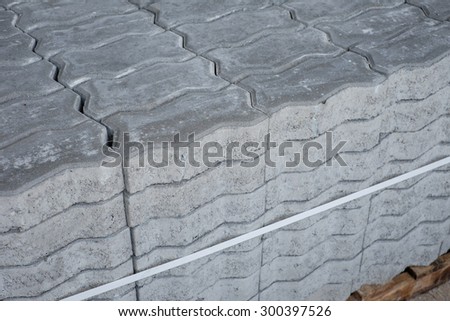 closeup pile of cement brick block in stock on wooden pallet