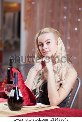 Young blonde woman at restaurant