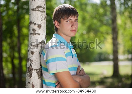 Outdoor natural portrait of a good looking young man