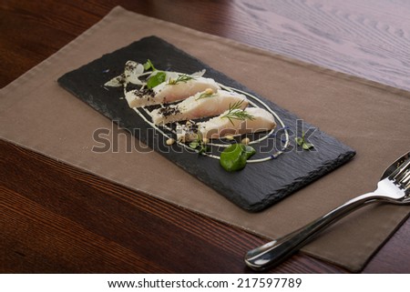 Whitefish fillet served on stone plate