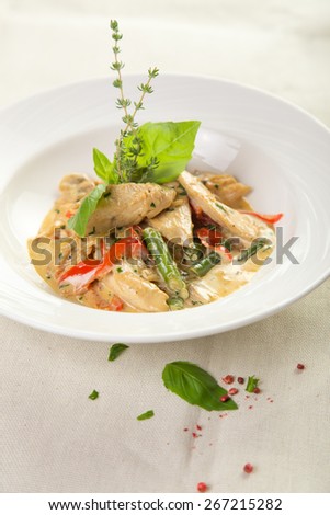 Braised chicken with pepper and bean isolated on the table at restaurant