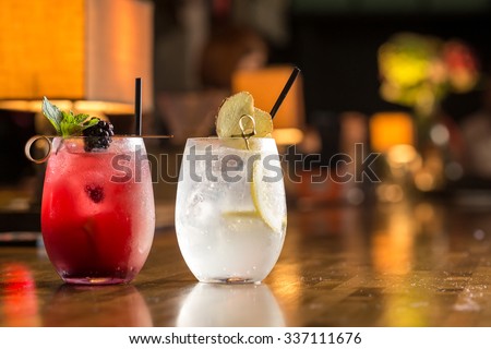 Two glasses of frozen lemonade on bar counter