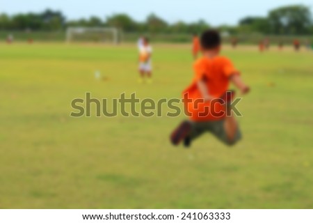 The kid big jump in soccer field